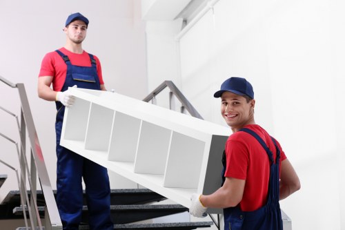 Careful packing of fragile household items for a local move in Kingstonuponthames