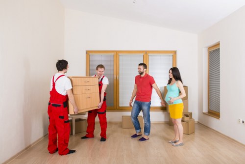 Packed moving boxes and furniture ready for transport