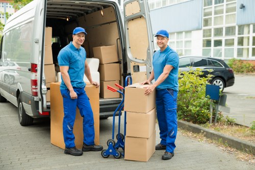 Organised boxes and personal items stored securely for a student move